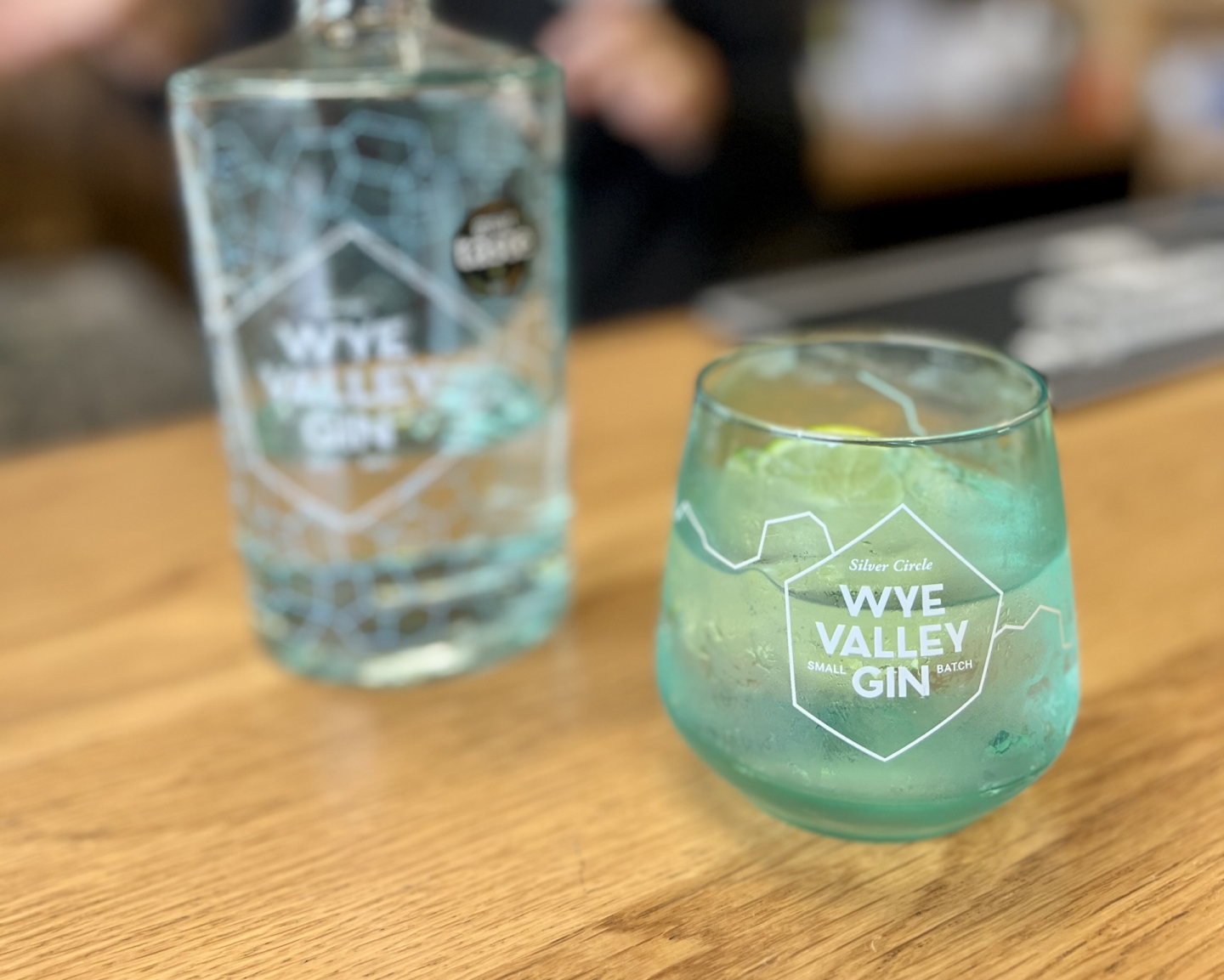 Wye Vallen Gin bottle and glass with gin and tonic in, on a bar top at Silver Circle Distillery.