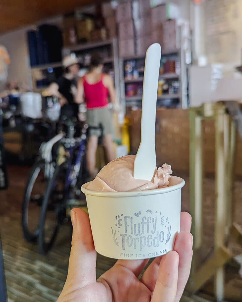 Small tub of ice cream with a spoon sticking out from Fluffy Torpedo ice cream shop