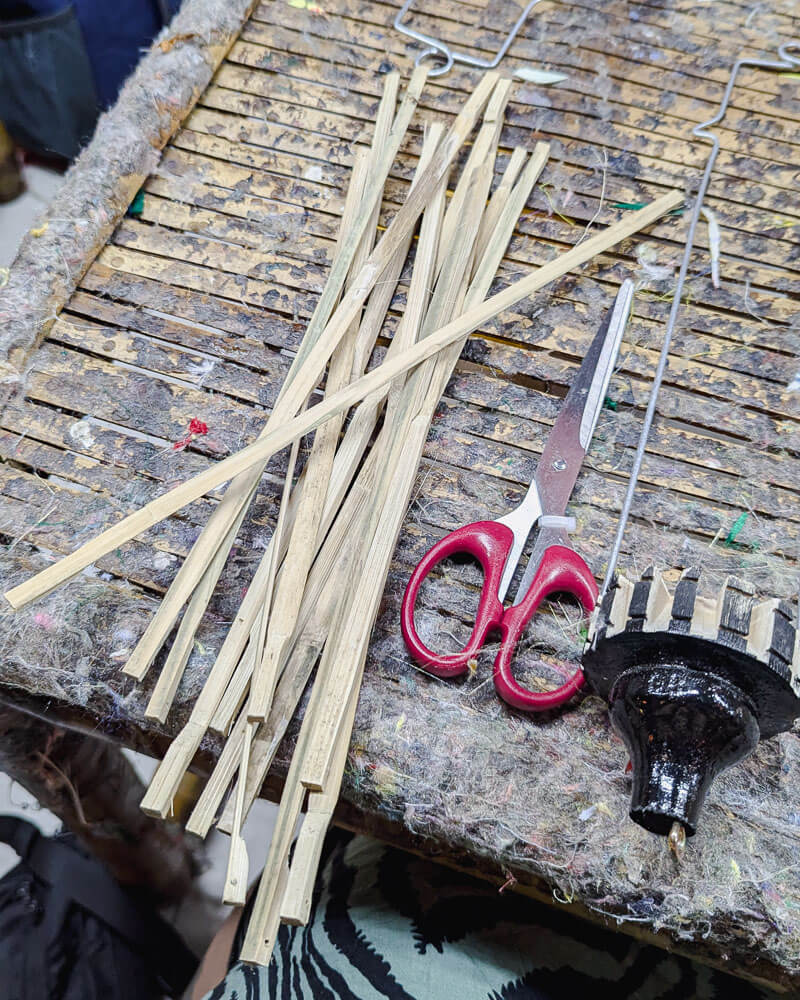 Bamboo sticks, scissors and a lantern frame at a Hoi An crafting class