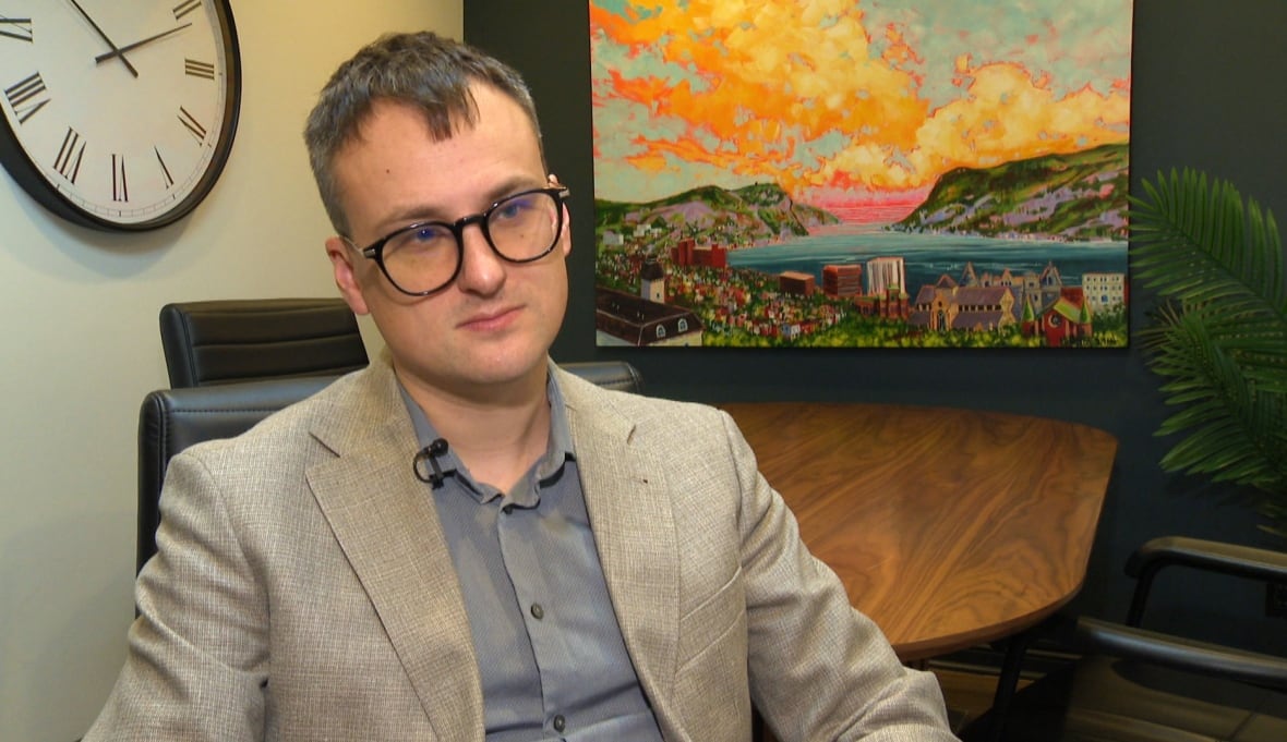 Man in blazer with glasses