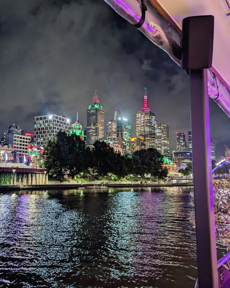 Night time views of Melbourne CBD buildings across the river Yarra